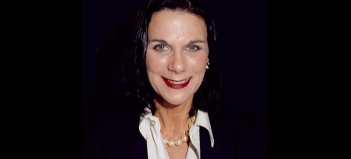 Desiree Gould smiling in a portrait.