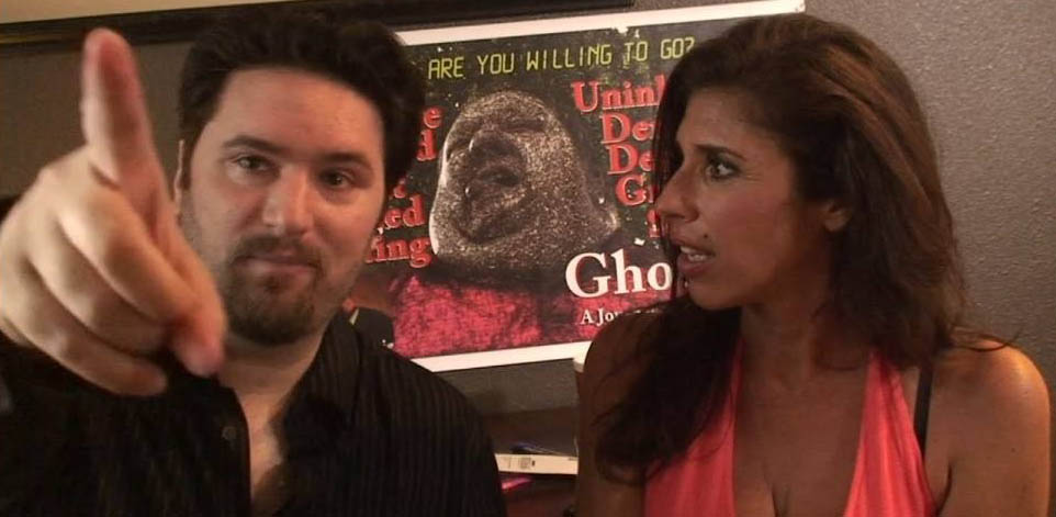 Jeff Hayes and Felissa Rose in front of a Ghoulish poster