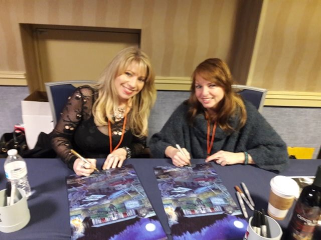 Amy Fields and Carole Chambers signing posters at Days of the Dead Atlanta