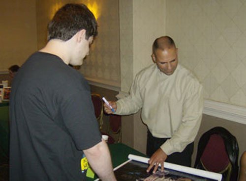 Geno signs the classic image