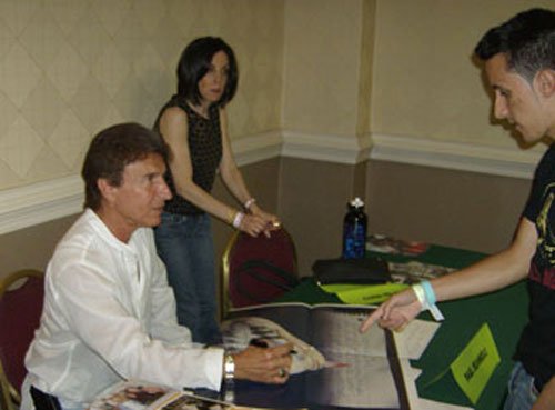 Paul adds his Ronniegraph to another original poster