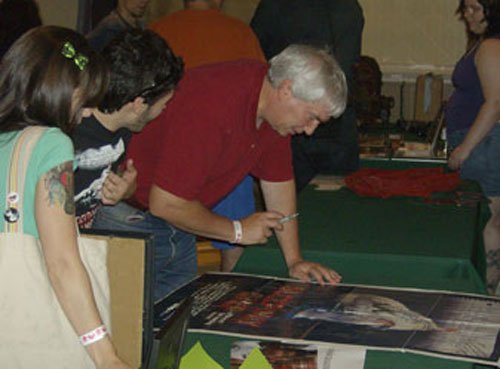 Robert signs the original 1-sheet