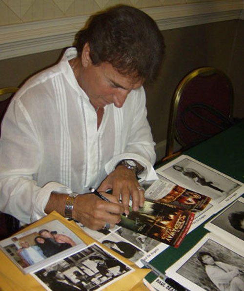 Paul signs a copy of Return To Sleepaway Camp