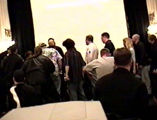 Fans rush the stage at the end of the show to try and obtain any leftover T-shirts!