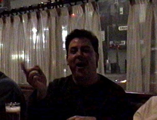 As if John Dunn didn't get asked to sing "HEY BOB A REE BOB" one time too many that day, he was asked to sing it again in the bar!! Notice his finger as he conducts the bar-room in a HEY-BOB sing-along!!