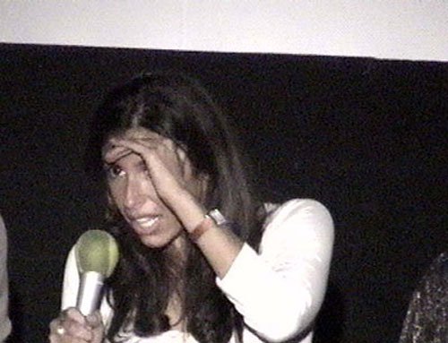 Felissa tries to get a handle on the spotlight glare.