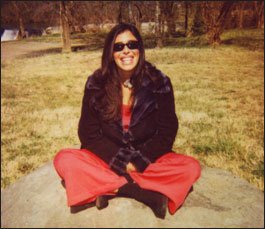 Felissa Rose sitting outdoors between takes on Trite This Way