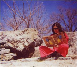 Actor reading the Book of Trite in a scene from Trite This Way