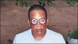 Daryl Wilcher posing in horror makeup on set