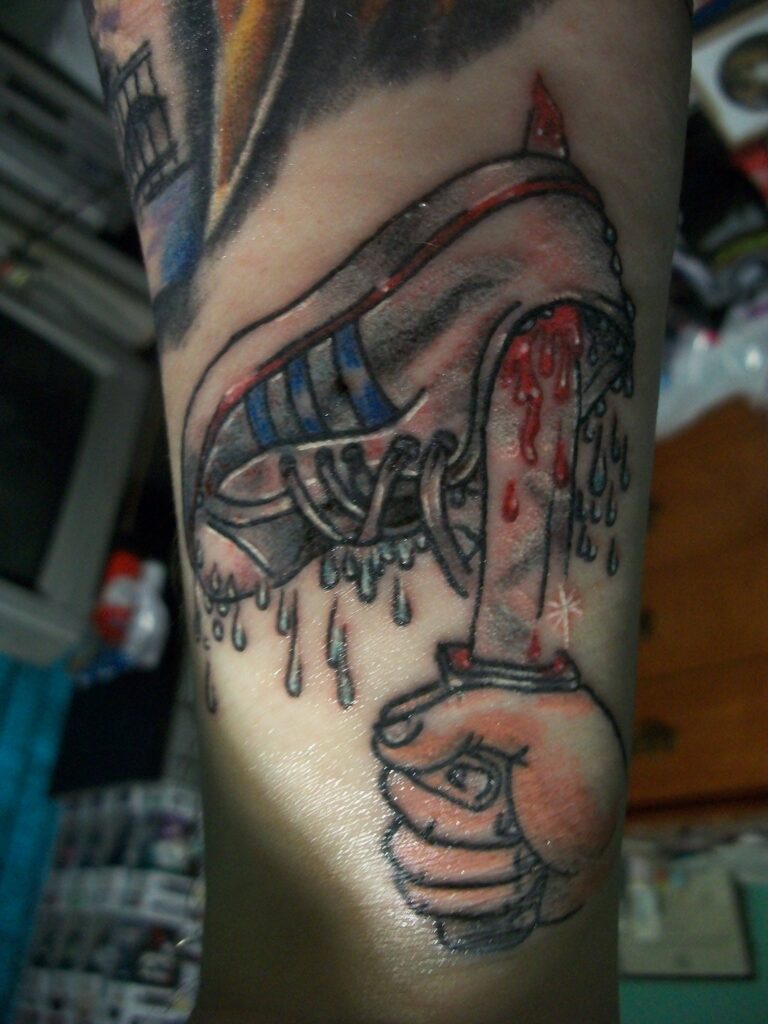 Sleepaway Camp tattoo featuring a bloody shoe and severed head