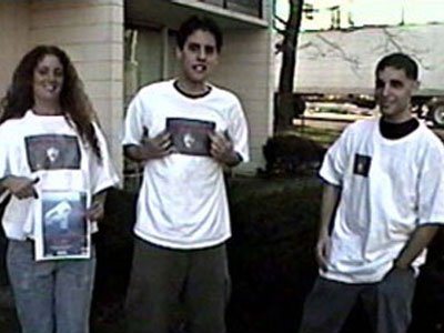 Sue, Matt, & Joe put on their spooky T-shirts in preparation for going to meet FELISSA