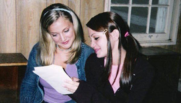 Erin and Samantha Hahn review the script in a deserted cabin in the middle of Sleepaway Camp