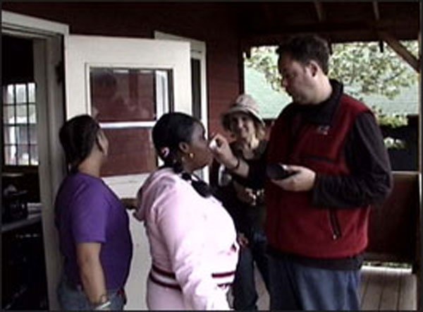 "Bella" gets touched up outside a cabin.