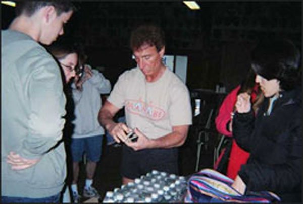 Between scenes, "Ronnie" keeps cast members entertained with some of his smooth card tricks.