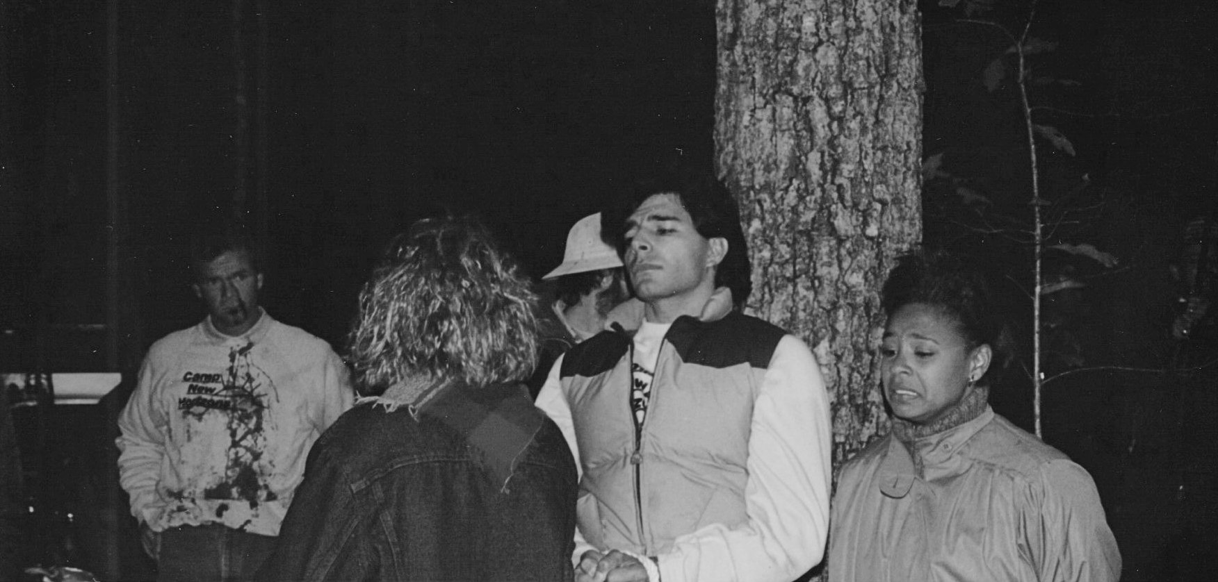 Cast members standing in the woods during a dark scene on the Sleepaway Camp III set