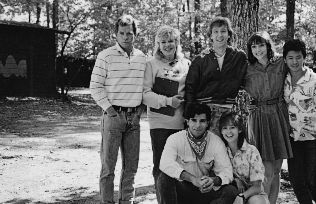Group portrait of cast members outdoors on the Sleepaway Camp III set
