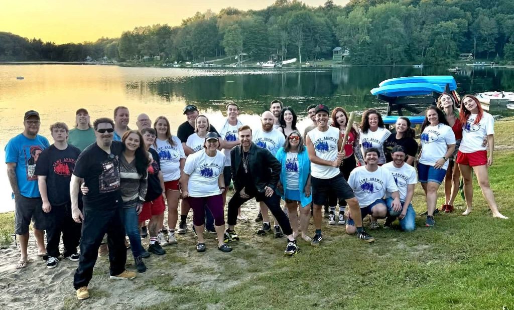 Sleepaway Camp fans posing beside the lake during the 2026 On Set Cinema location tour.
